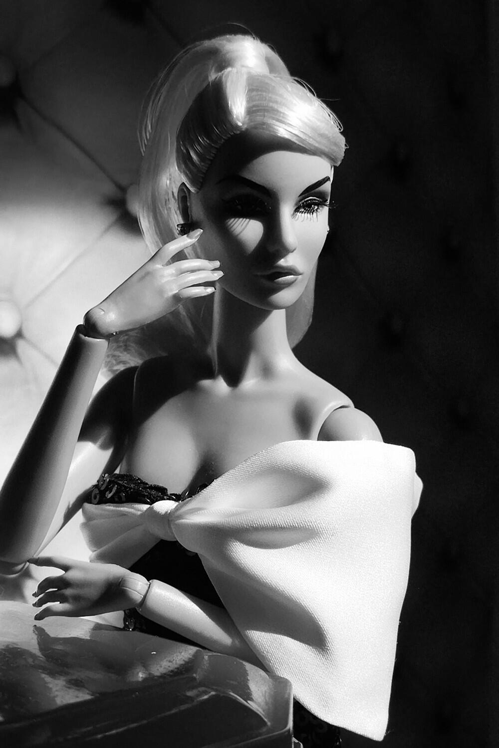 Dramatic black and white doll portrait inspired by Harcourt studio lighting