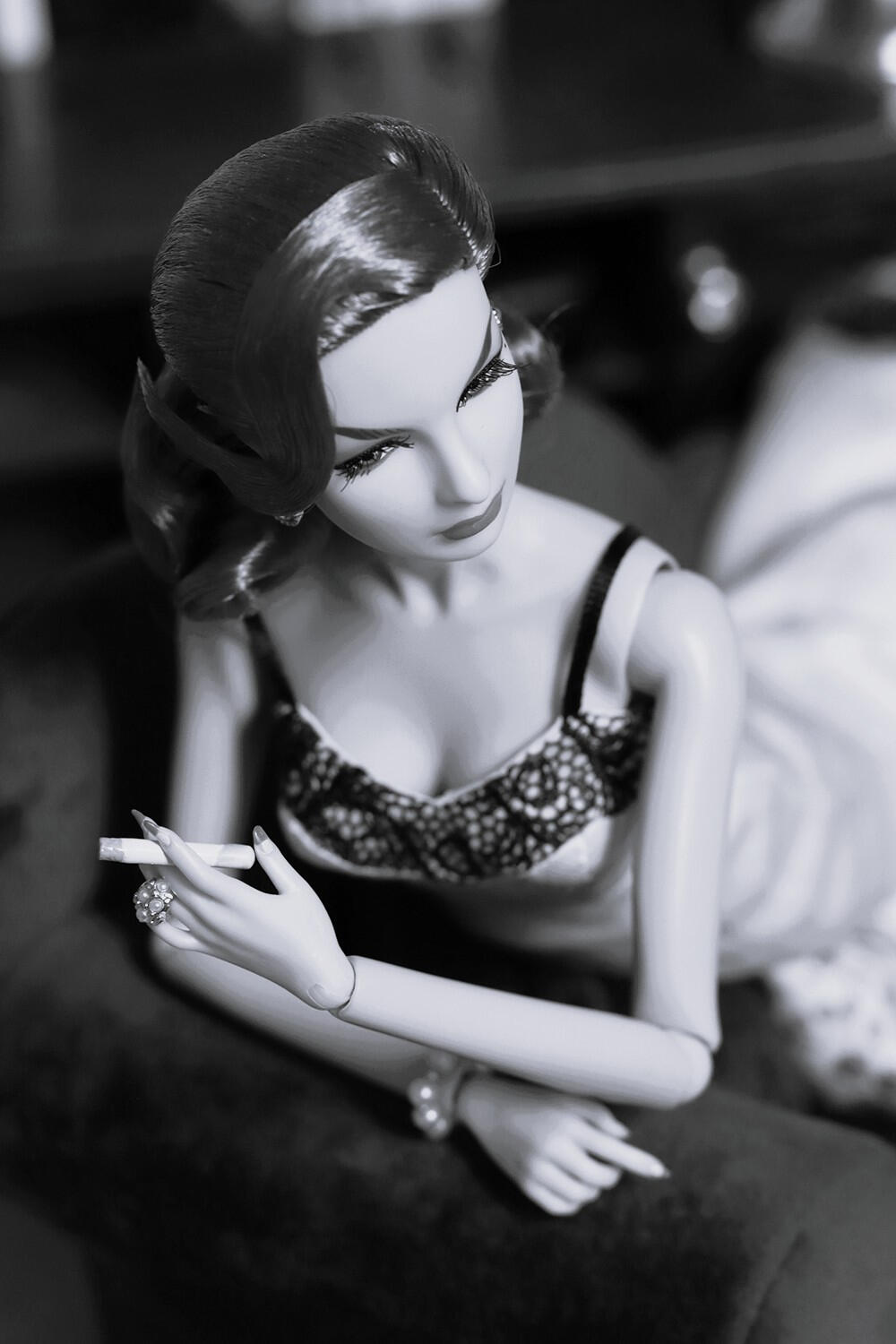 Black and white doll portrait with film noir cinematic atmosphere