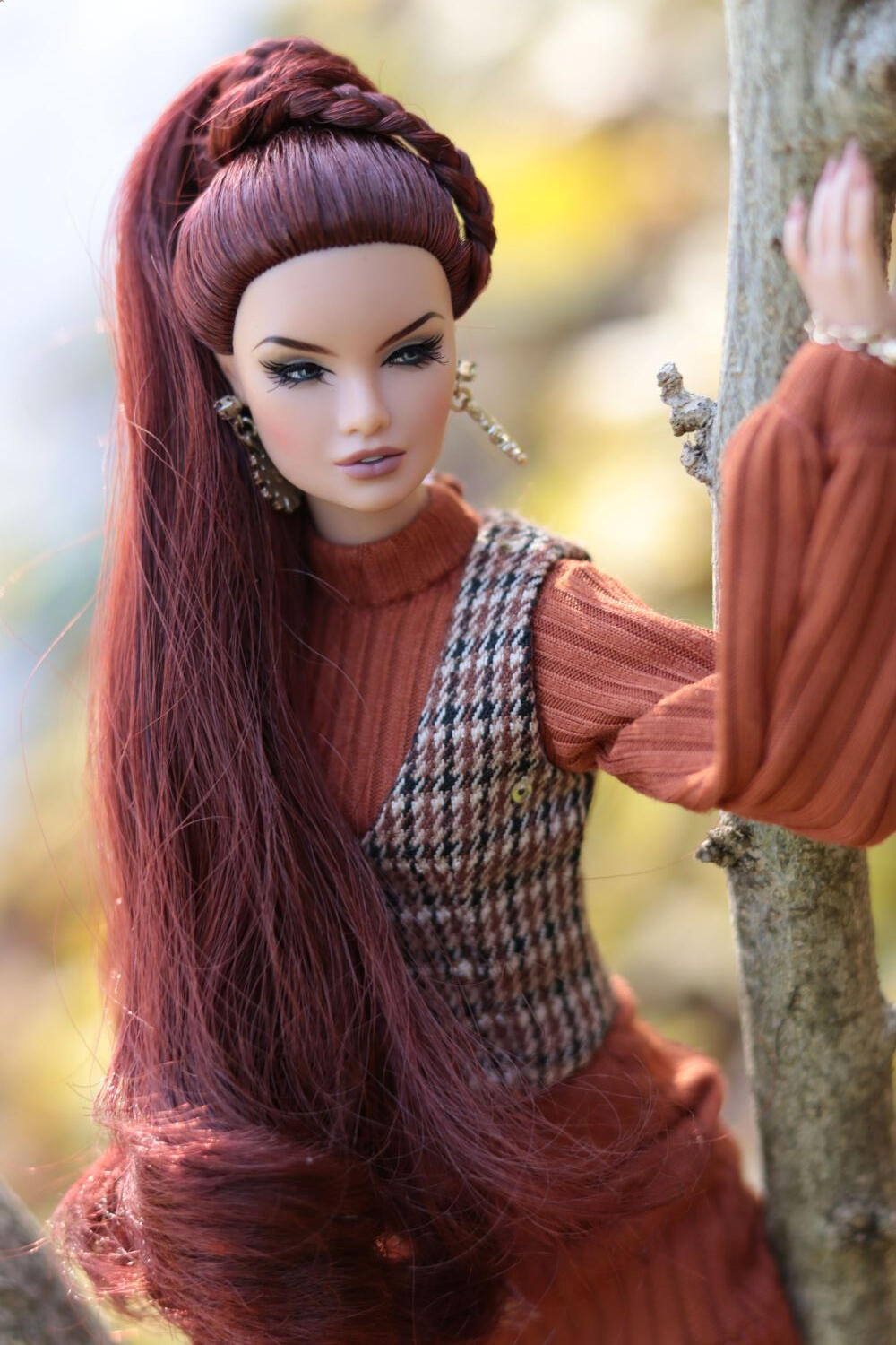 Red-haired doll in warm golden light, cinematic portrait, doll photography